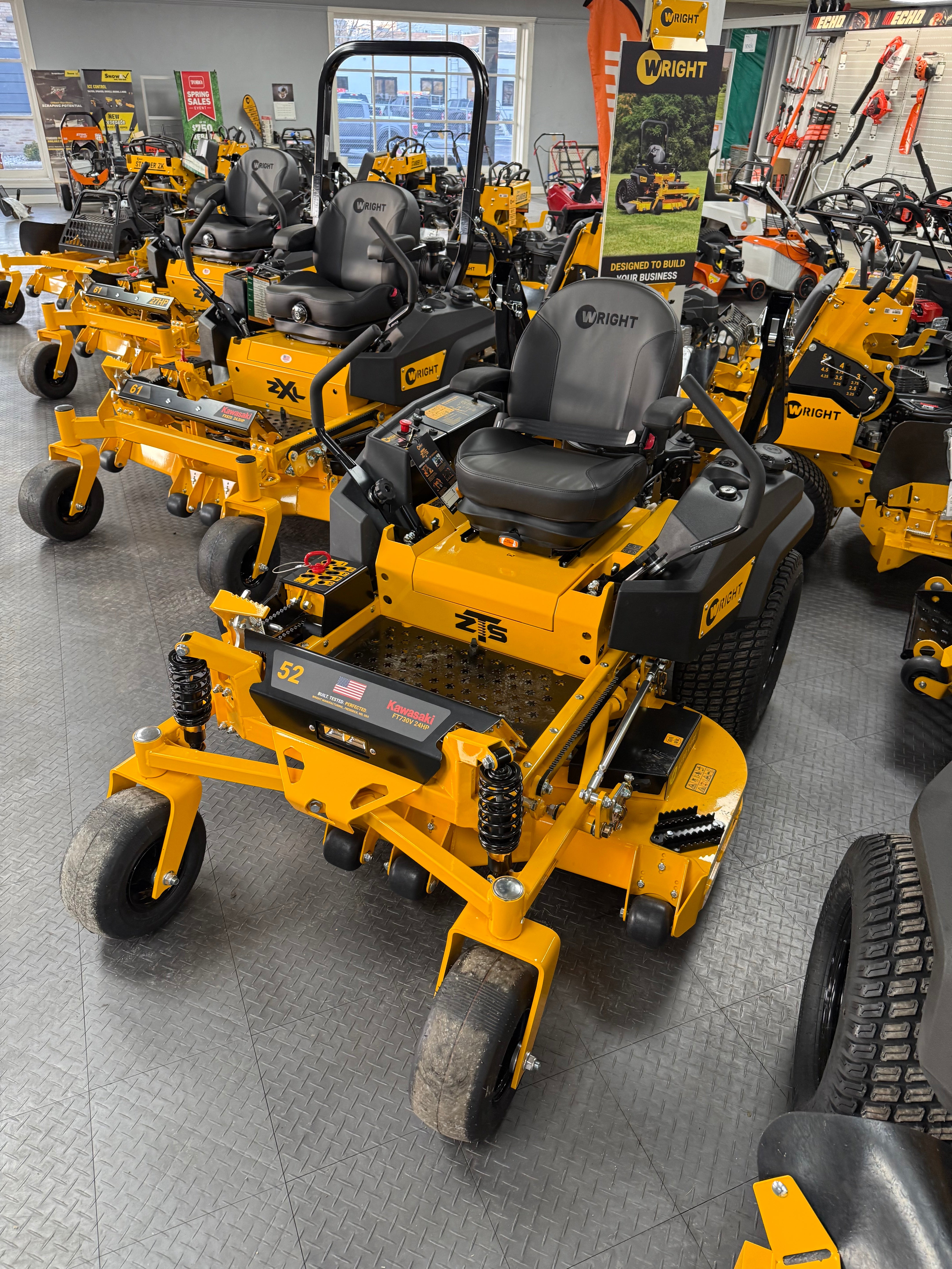 Yellow construction equipment on display in a showroom